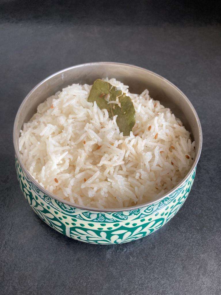 Tarka zeera Rice in a blue bowl.