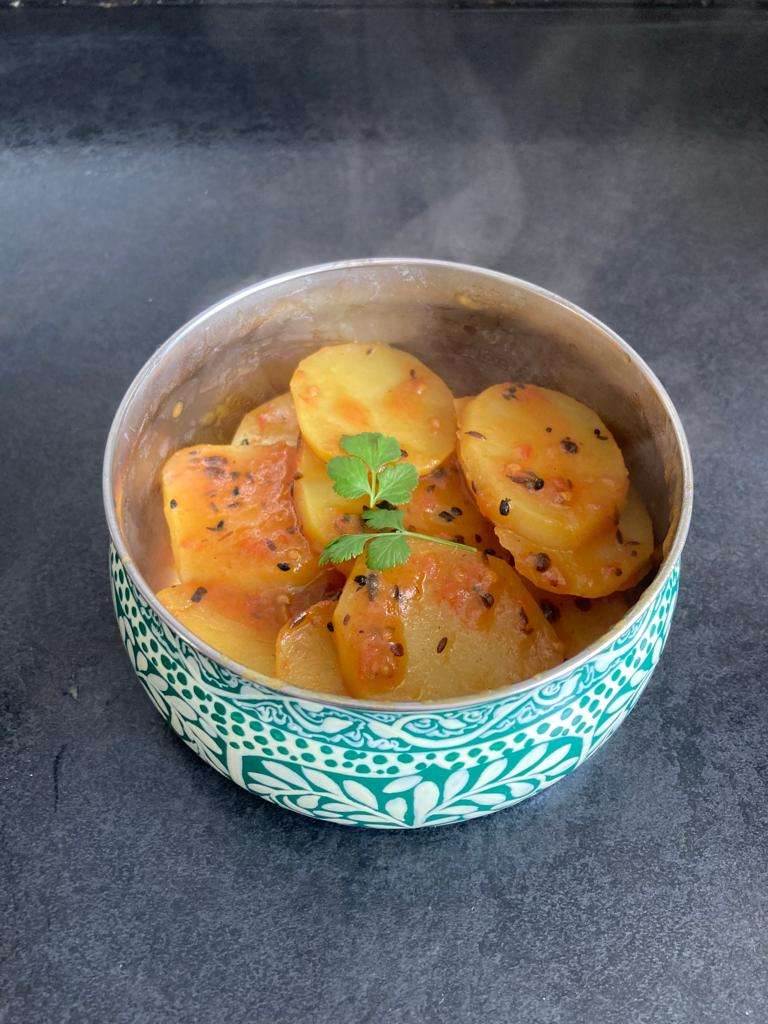 Photo of Aloo Katalian in a blue bowl. 