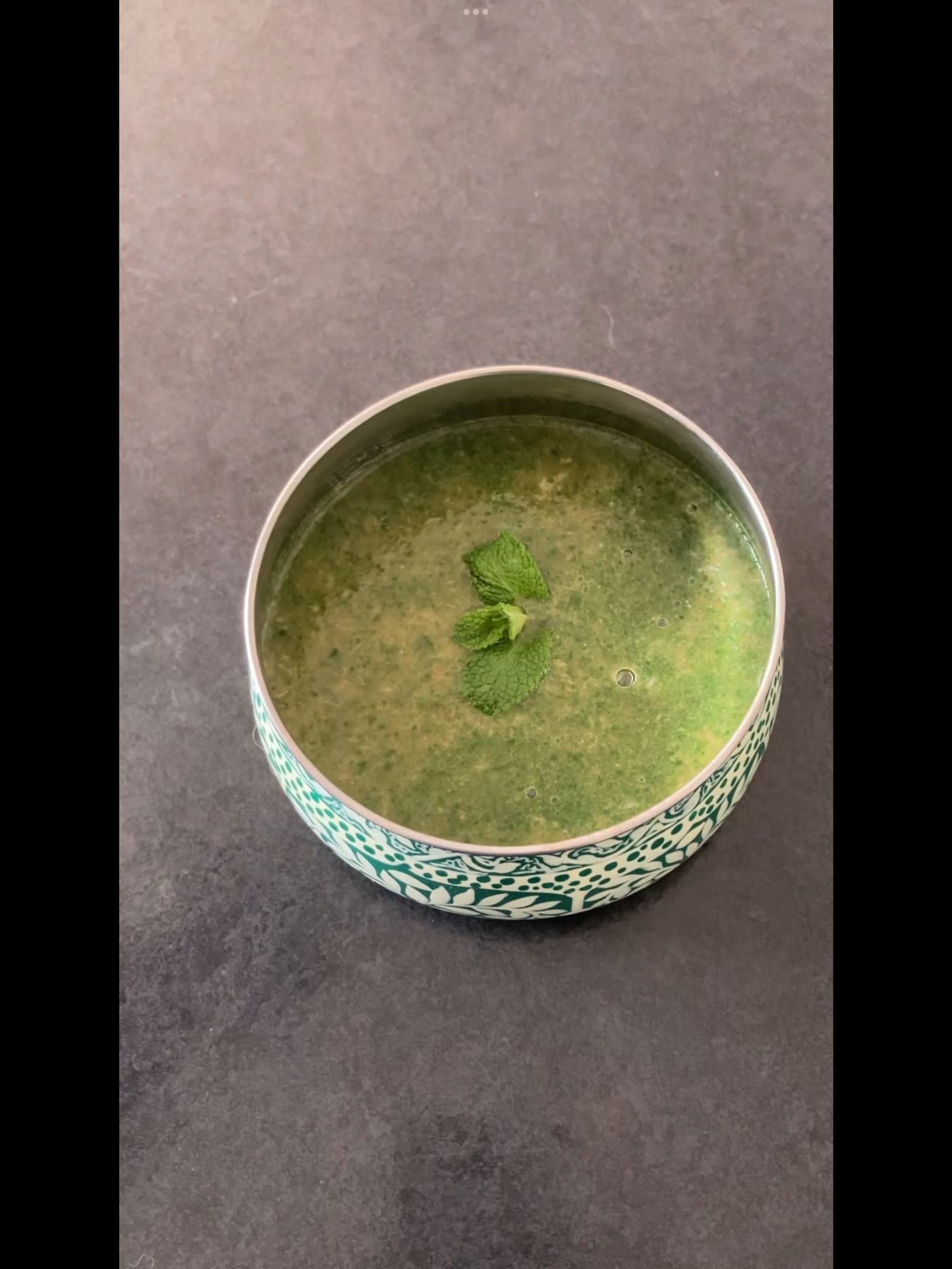 Spicy mint chutney in a blue bowl