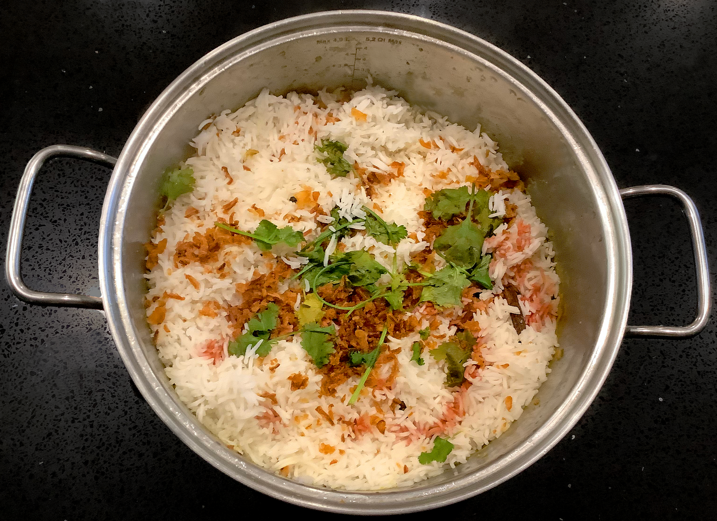 Yakhni Pilau rice in a large metallic bowl.
