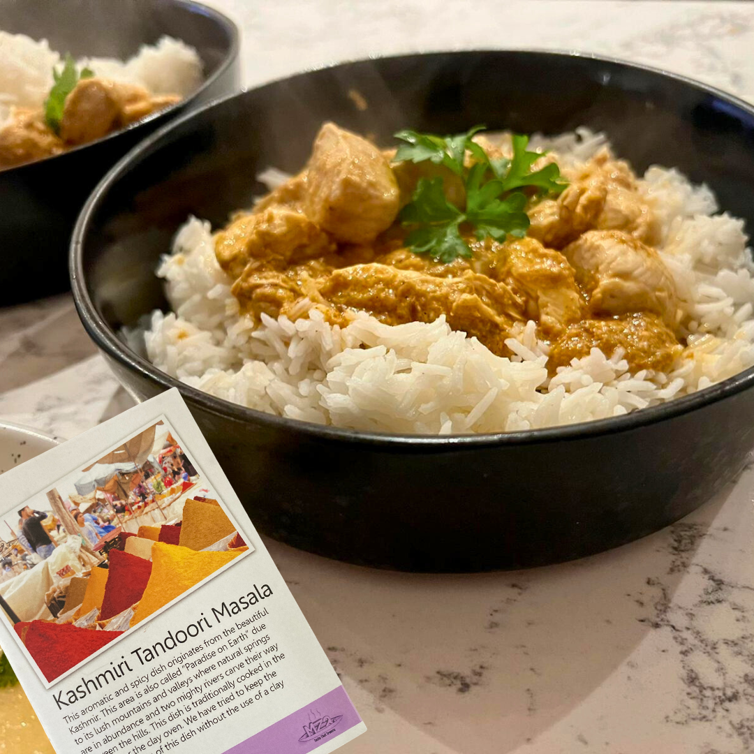 Photo of Kashmiri tandoori masala in a bowl next to the recipe card