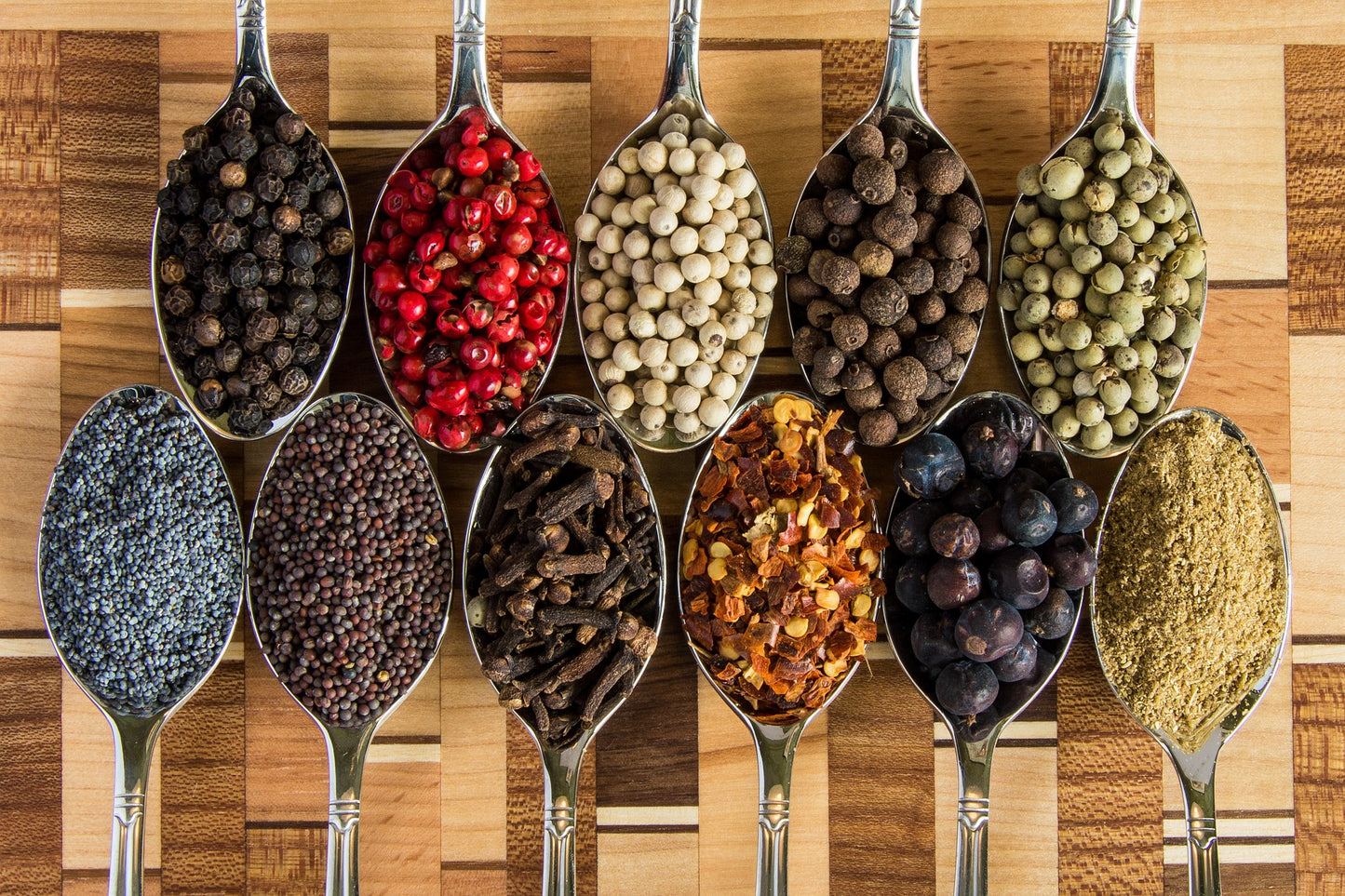 various spoons of whole spices. 
